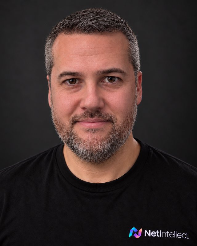 Net Intellect network specialist in a black Net Intellect T-shirt